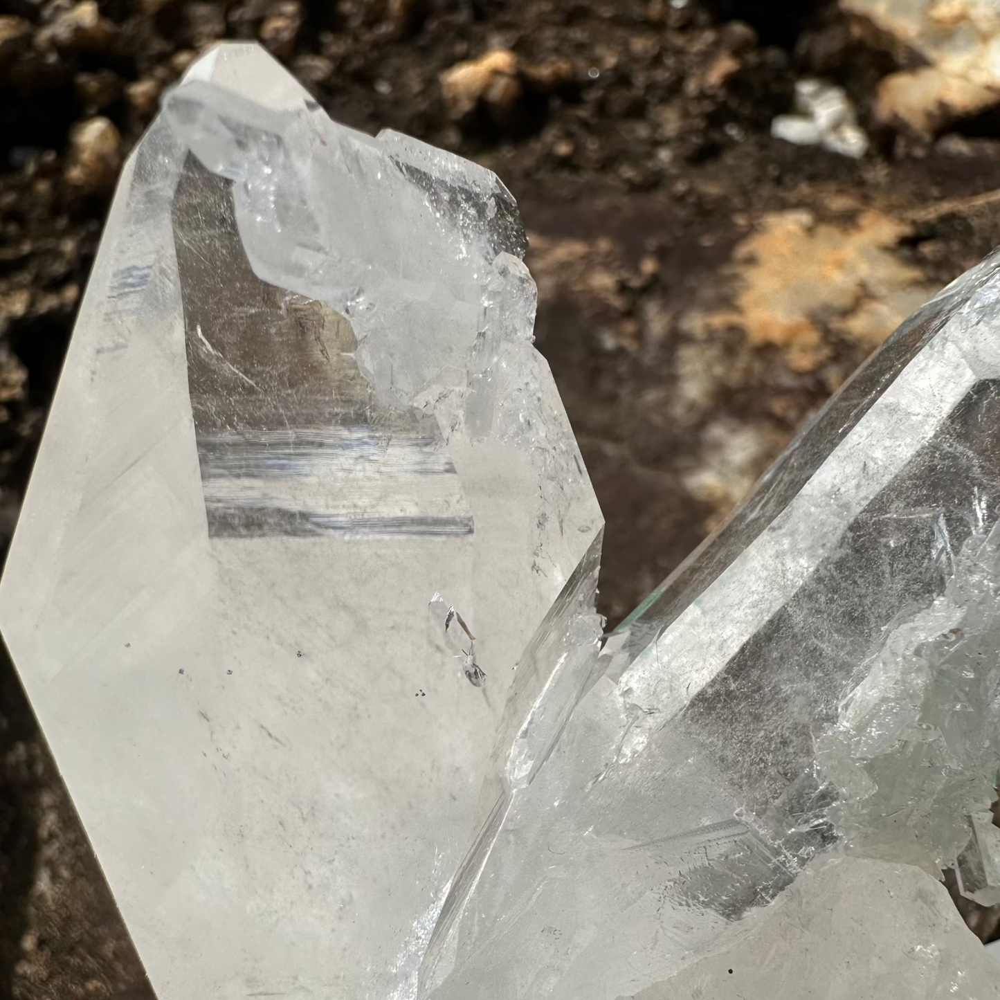 Close Up Of Large Clear Crystal Point On Cluster