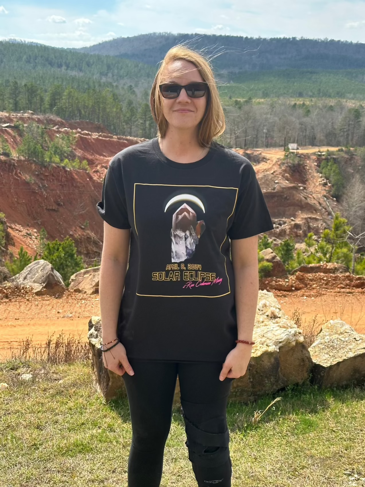 Woman Wearing Black T-Shirt With Mountains in the background