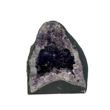 Load image into Gallery viewer, Front Side Of Amethyst Geode Cathedral, The Crystal Center Is Dark And Light Purple Crystal Point, And Around The Outer Edges Of The Face Is Painted A Flat Black
