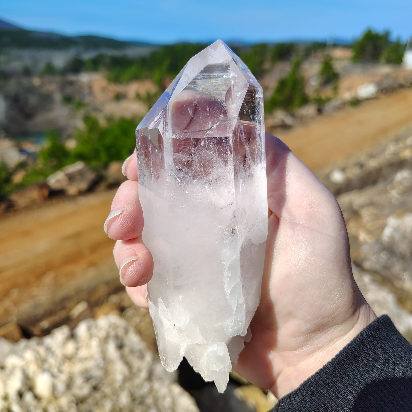 This is the right side of this Quartz crystal point, and it is half clear and half white.