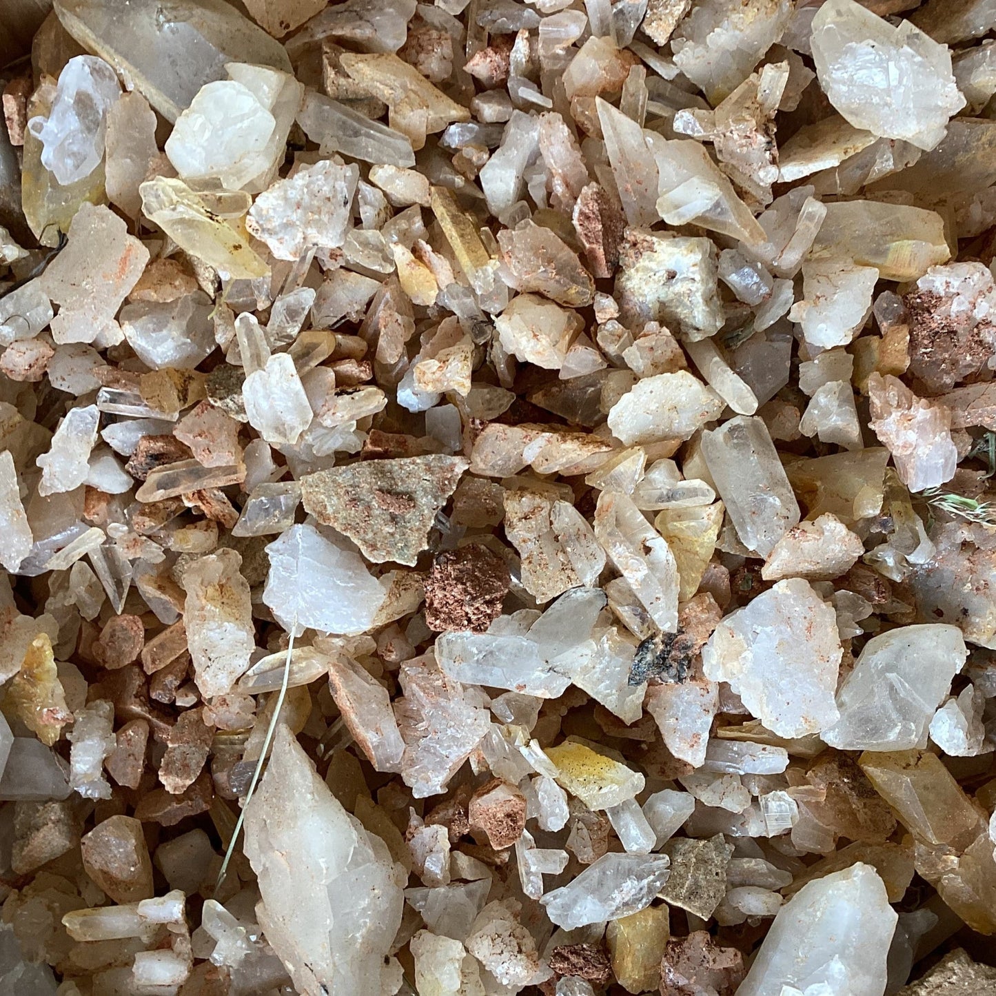 Close-up of small stones and crystals with a brownish background