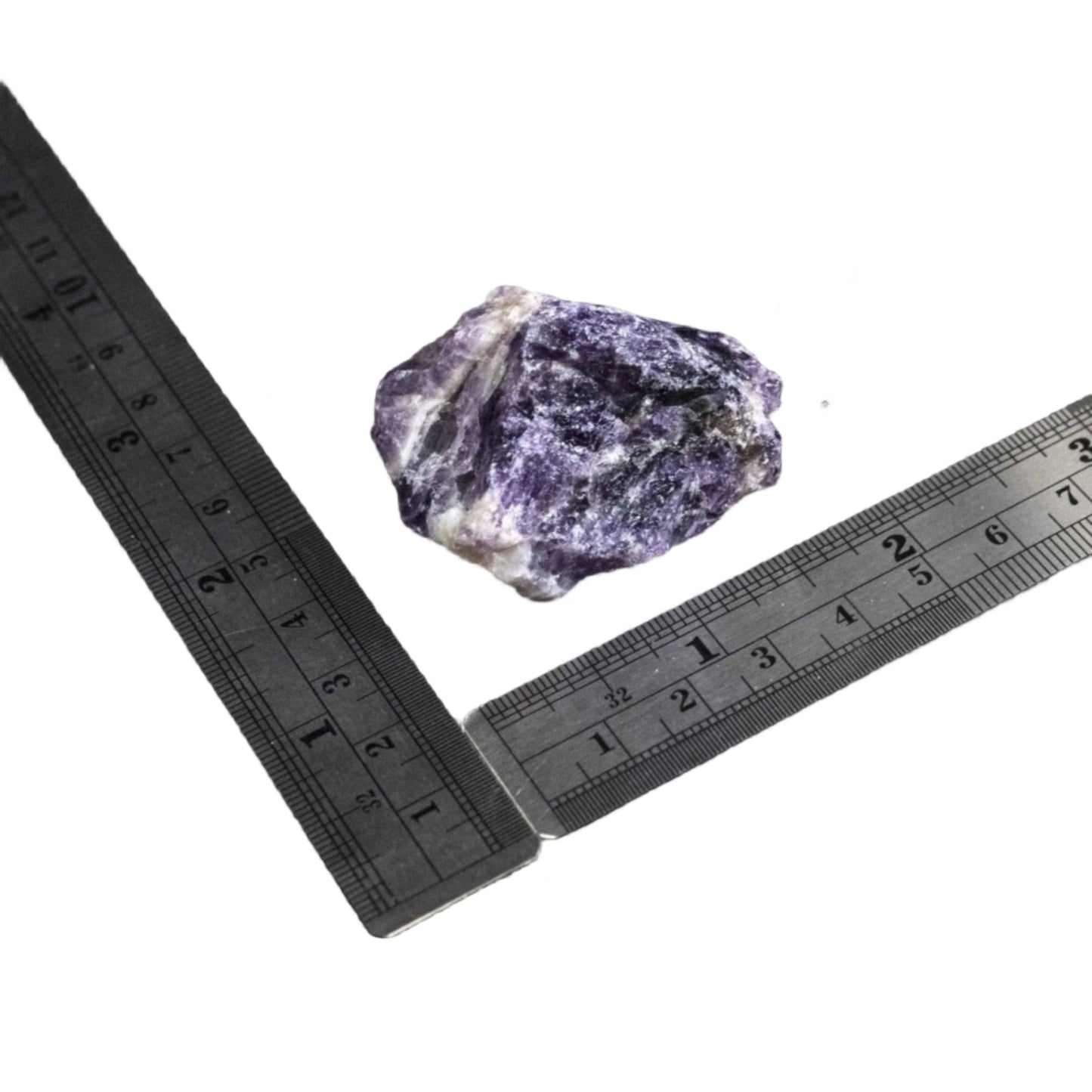 Raw Chevron Amethyst stone with two rulers