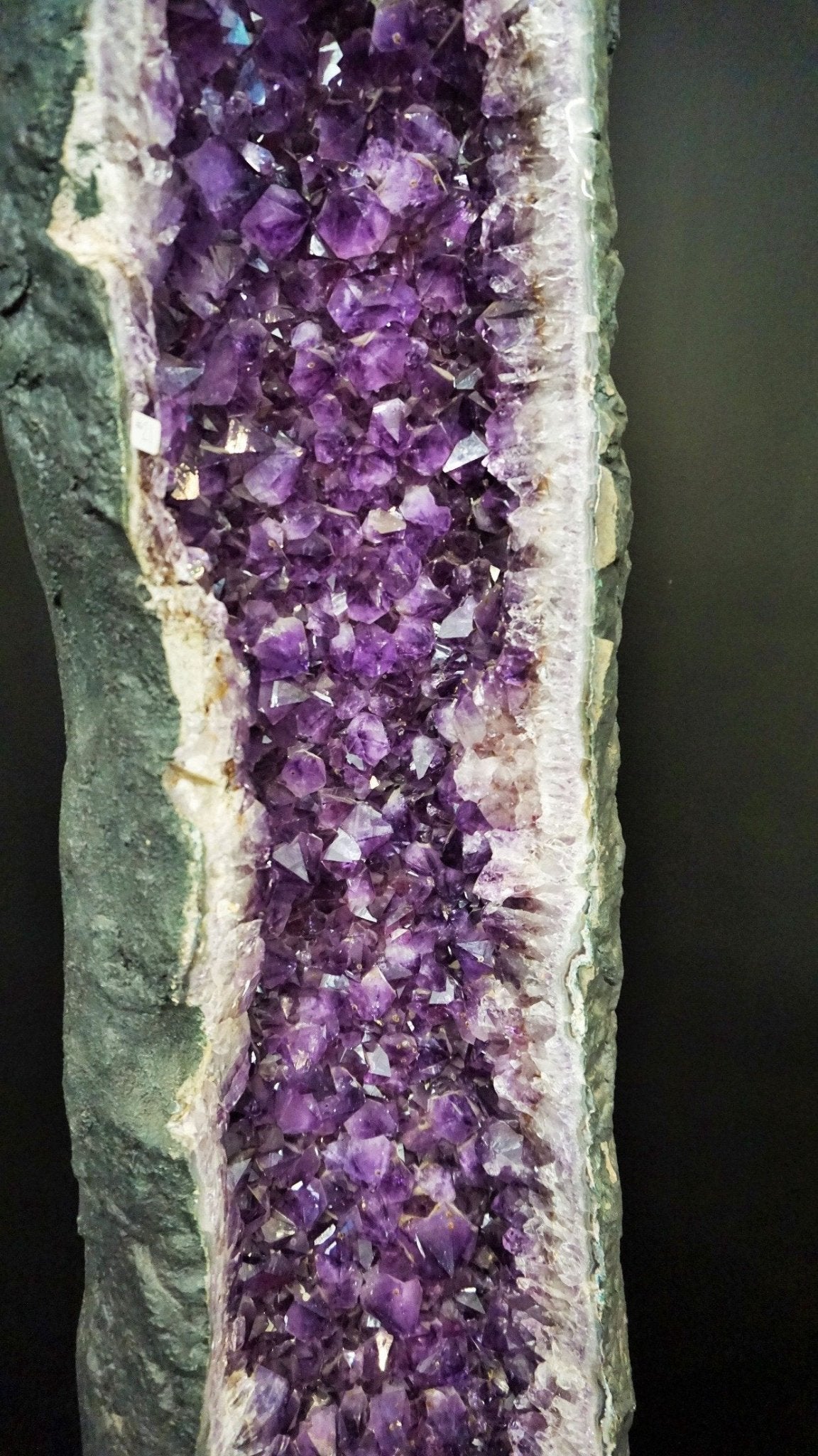 Close Up Of Amethyst Crystal Clusters Within A Geode