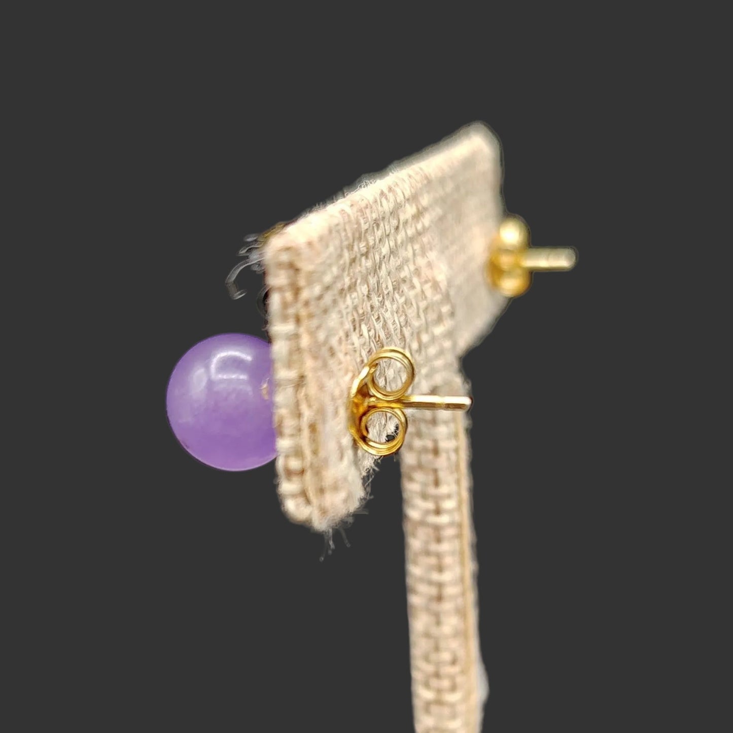 Close up of the gold-plated Sterling Silver butterfly style earring backs.