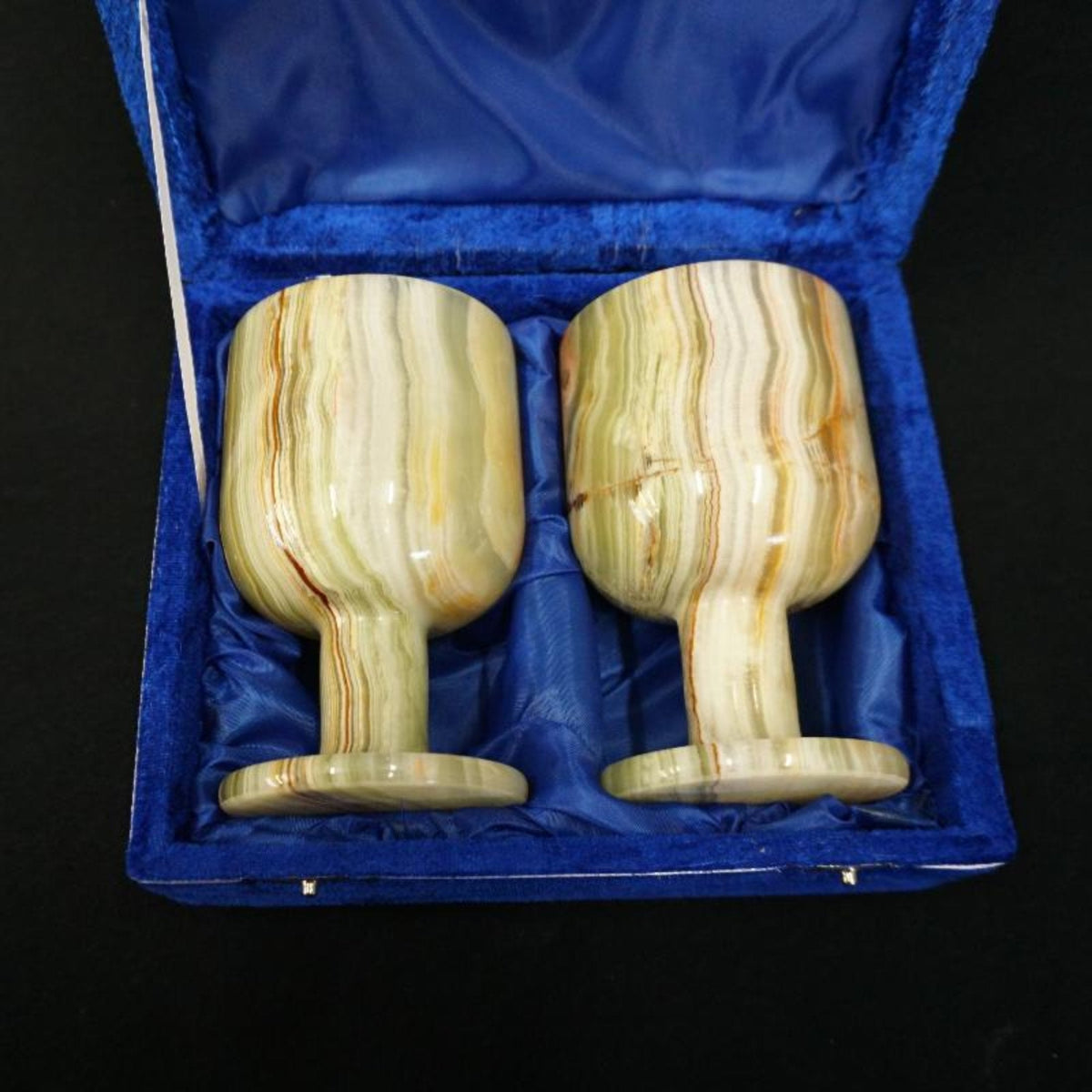 close up of Handcrafted Onyx Goblet Set in blue case