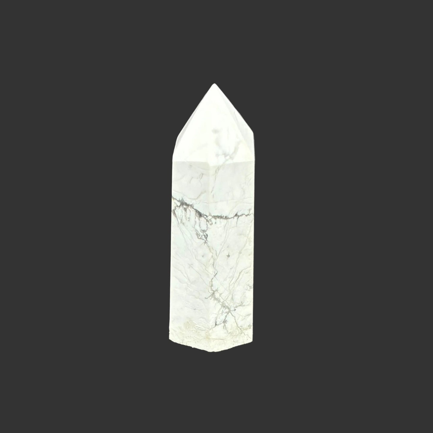 This is the right side of this polished white Howlite tower.