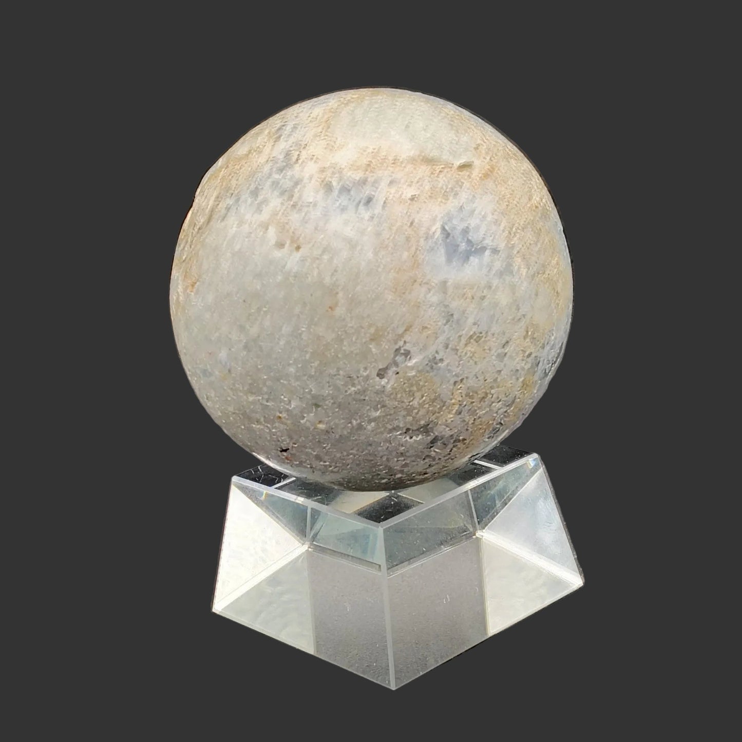This is the back side of this blue Celestite sphere, on a clear acrylic stand.