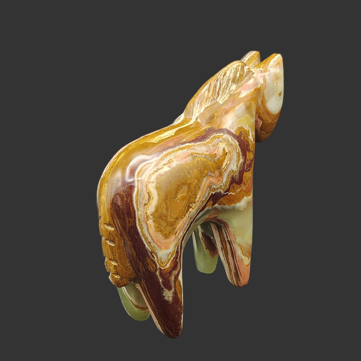 This is the back side of this polished Onyx horse