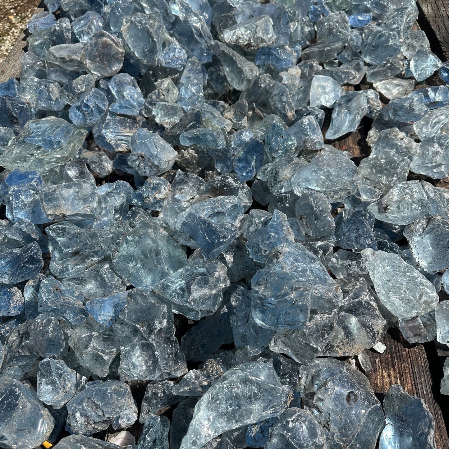 Table filled with light blue slag glass