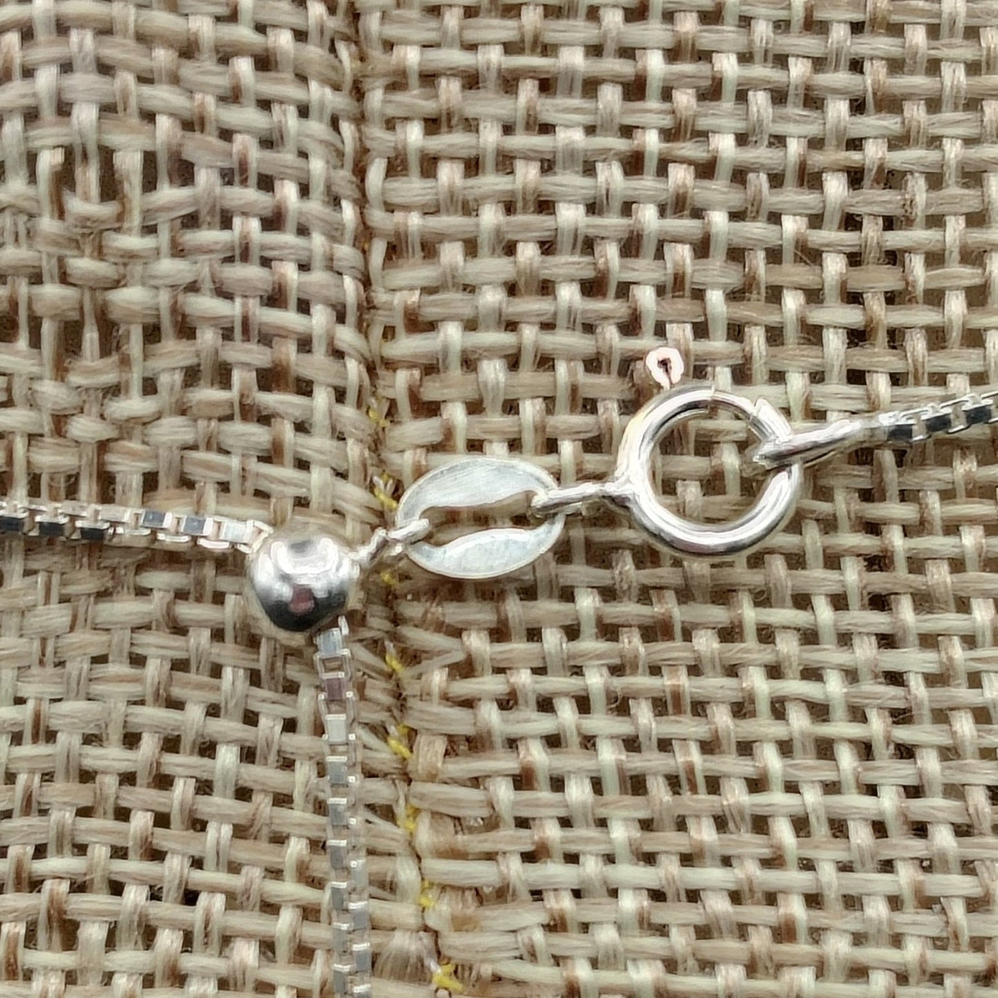 Close up of the Sterling Silver spring ring clasp and the adjustable box chain.