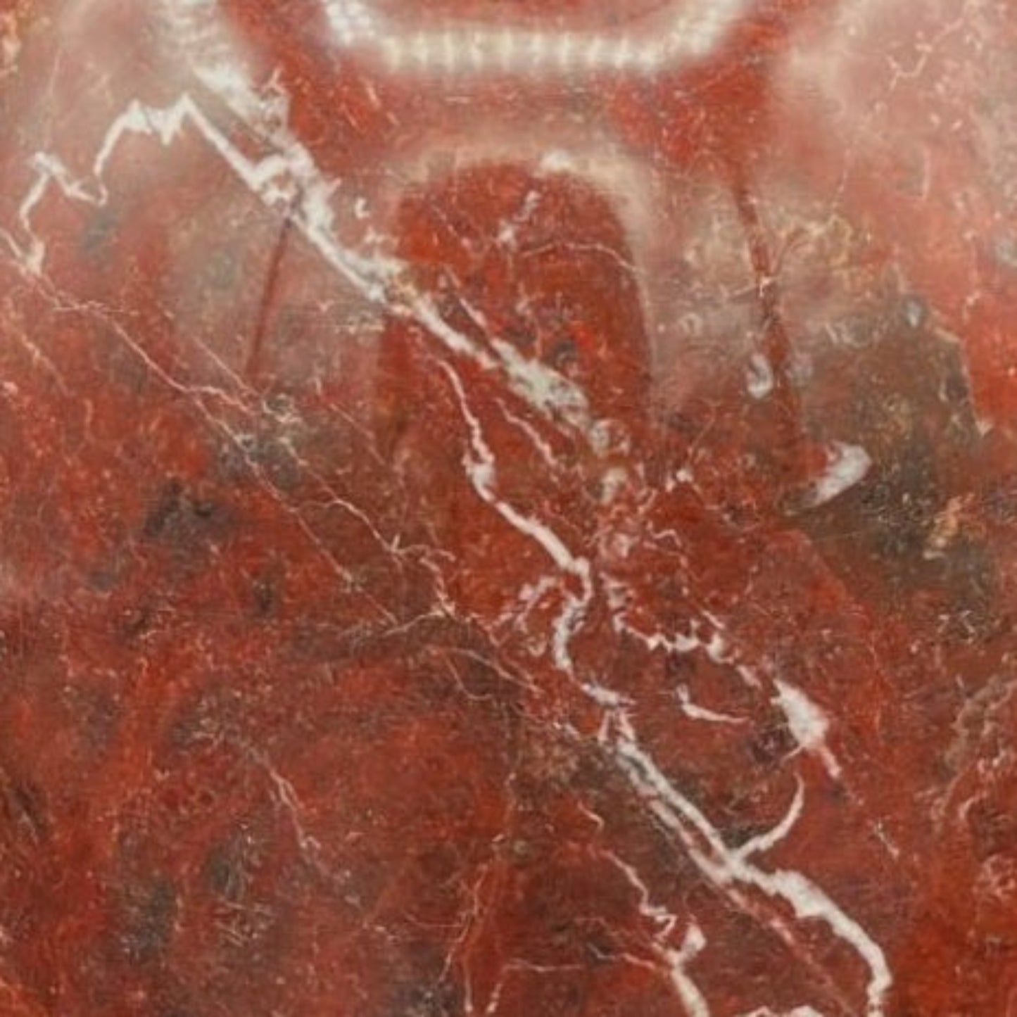 Close Up of Red Onyx Vase Showing The Veins
