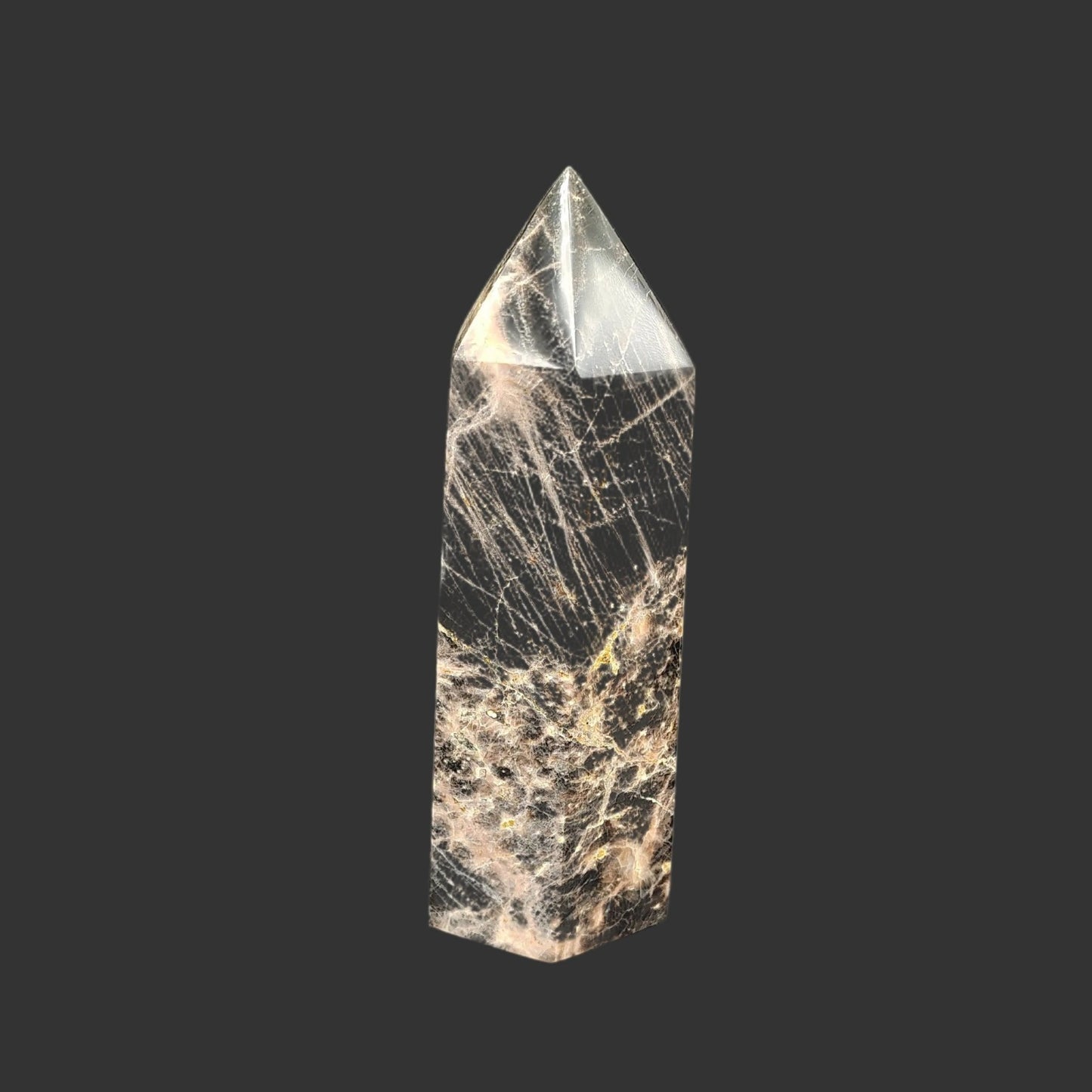 This is the right side of this cut and polished black moonstone point. It is mostly black at the top