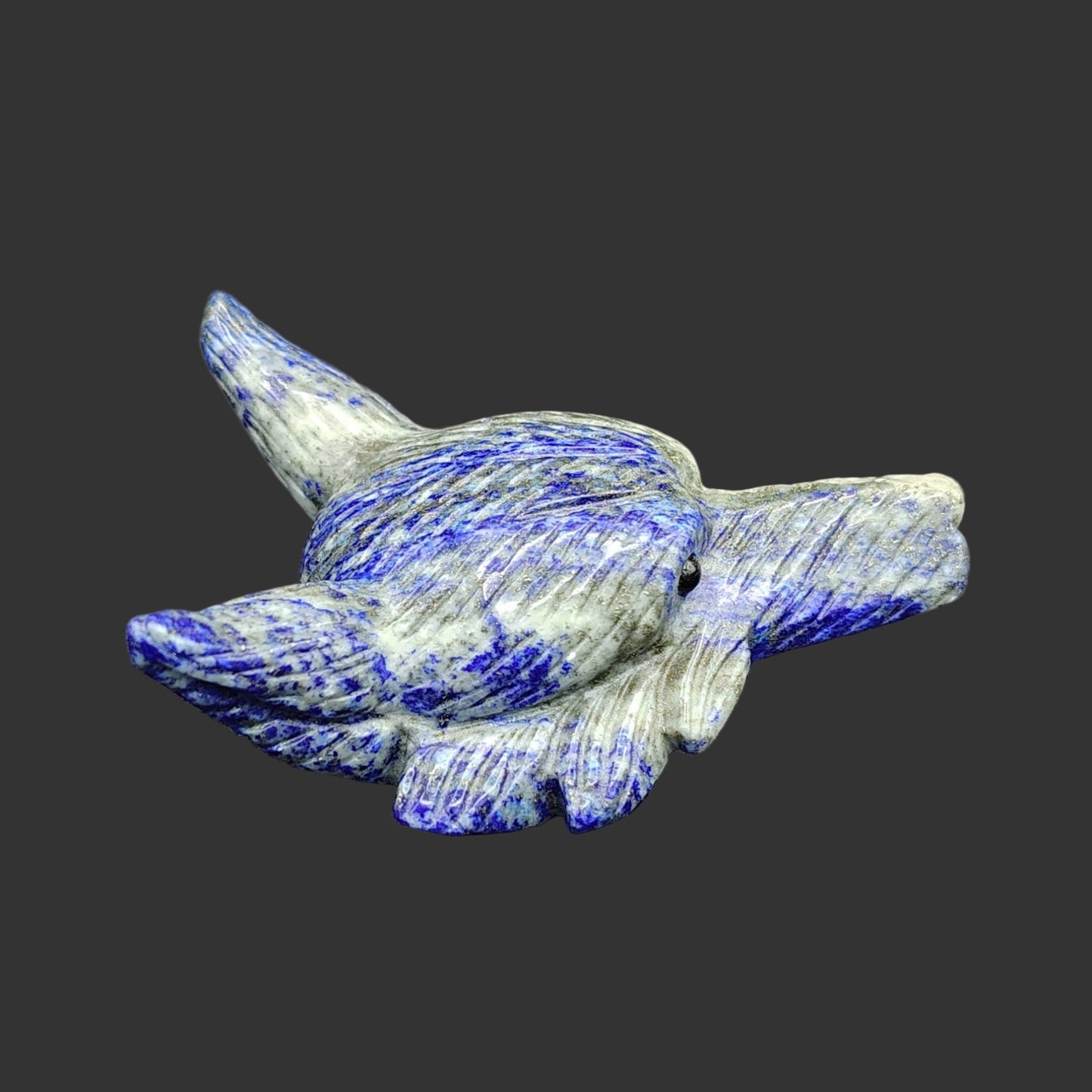 This is the right side of this lapis lazuli wolf head figurine