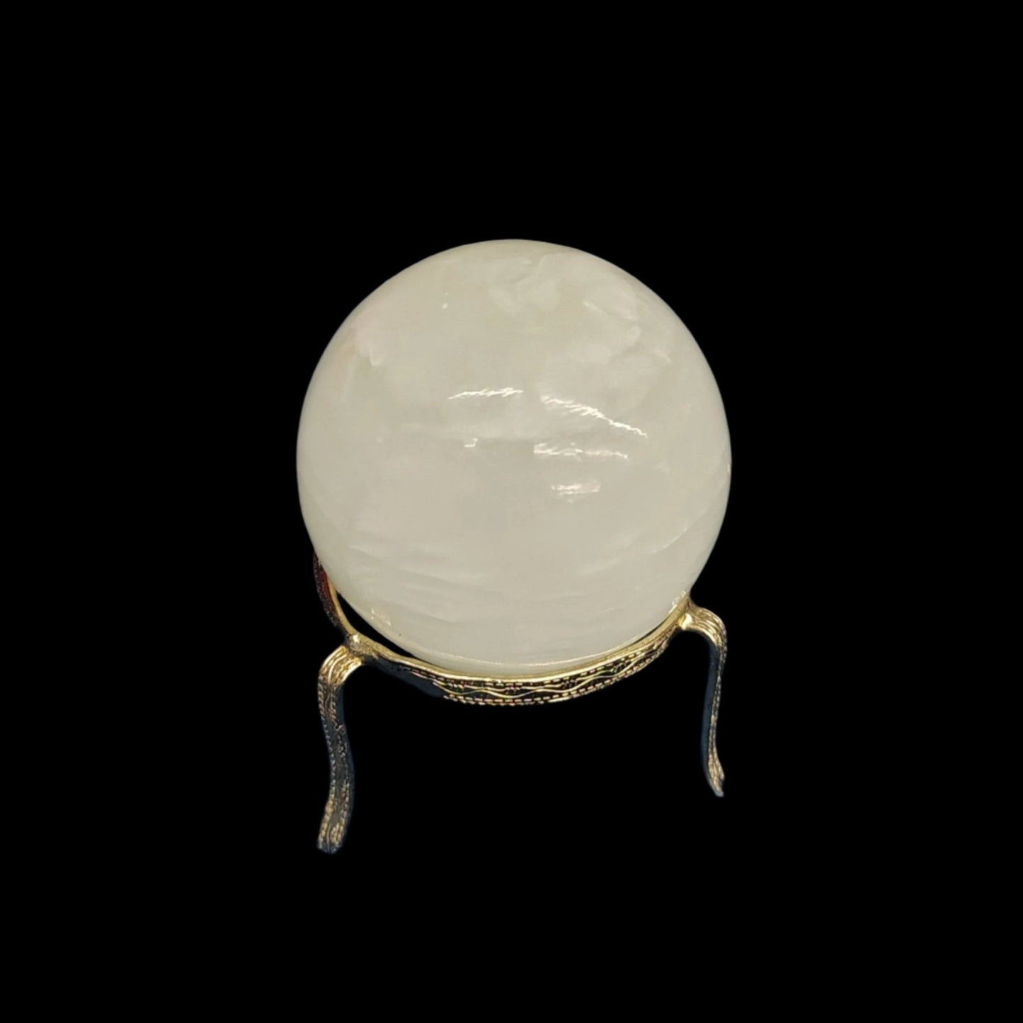 This is the polished green Calcite sphere in artificial light