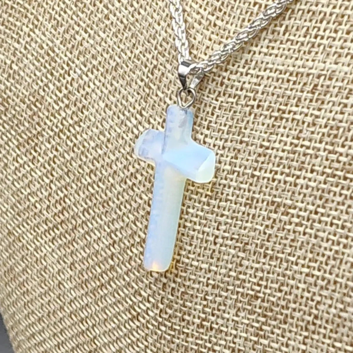 This is a close up of the polished Opalite cross pendant.