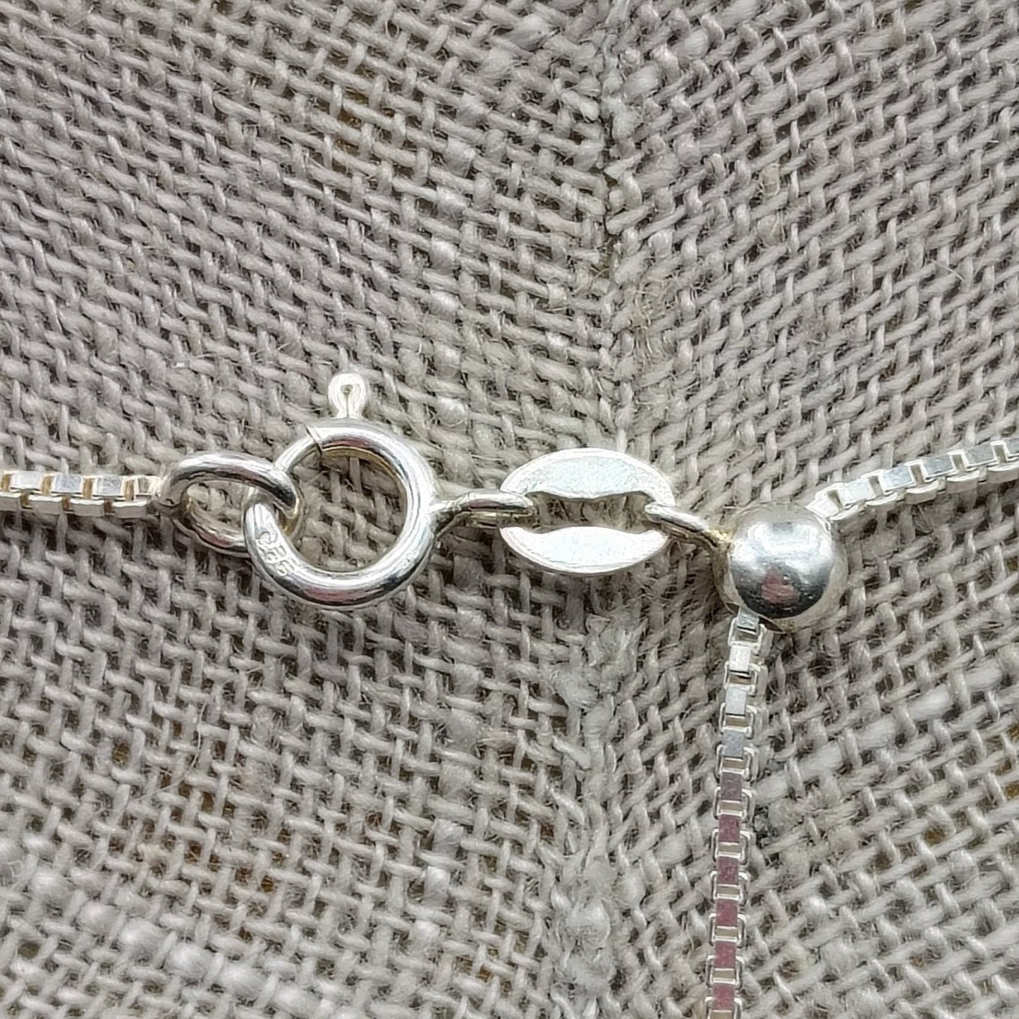 This is a close up of the sterling silver spring ring clasp