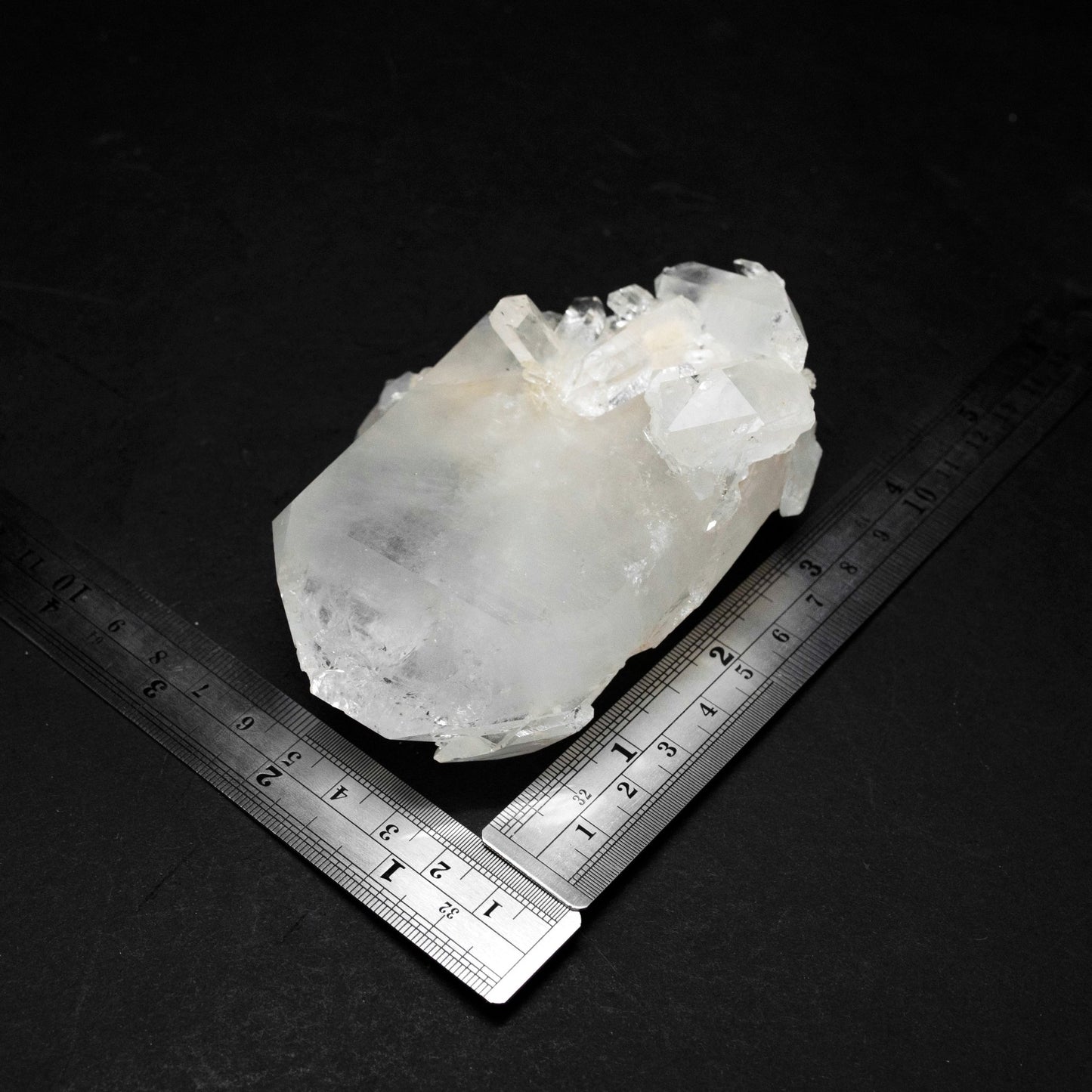View Of A Quartz Cluster WIth A Tabular Crystal And two metal rulers