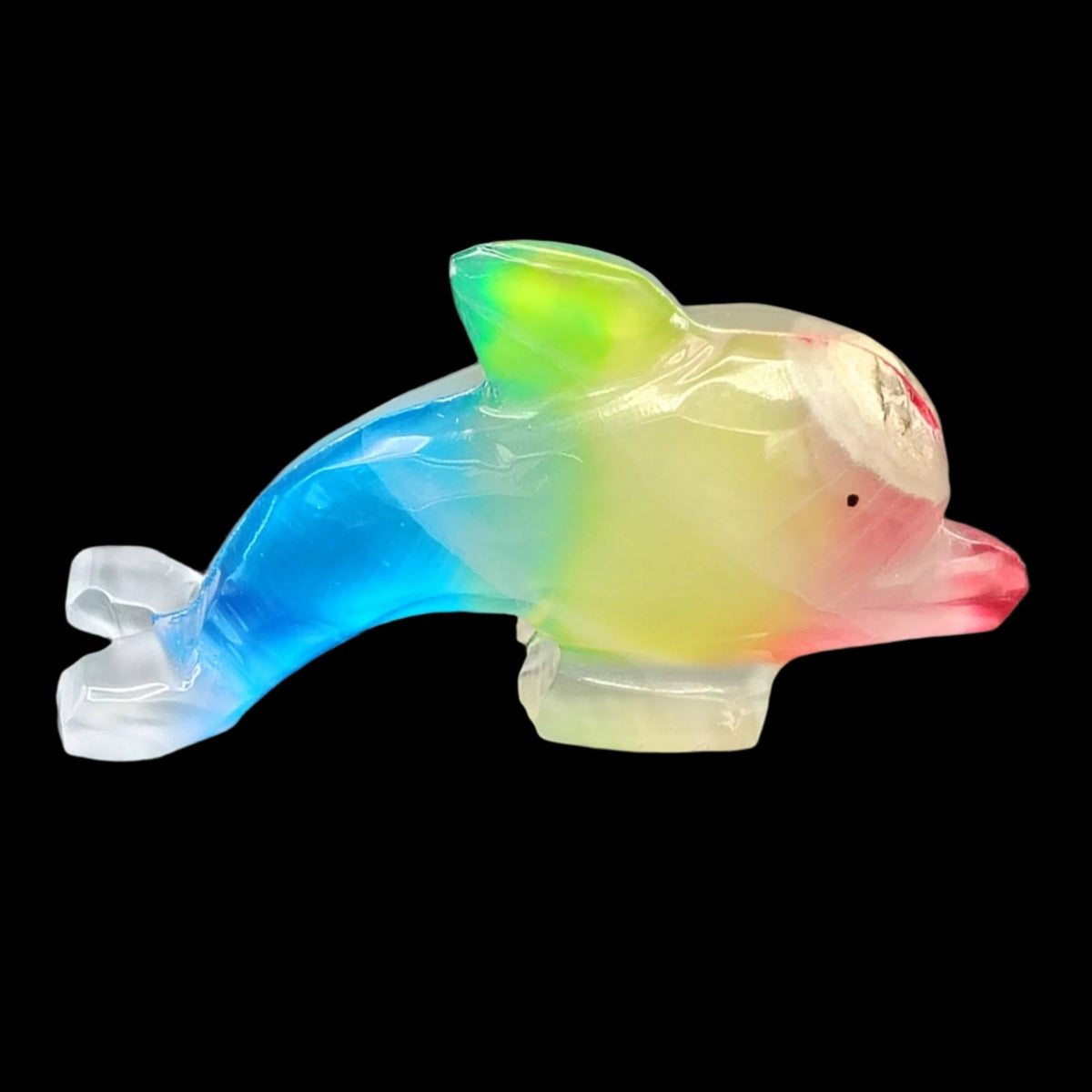 This is the right side of this rainbow Onyx dolphin in artificial indoor lighting