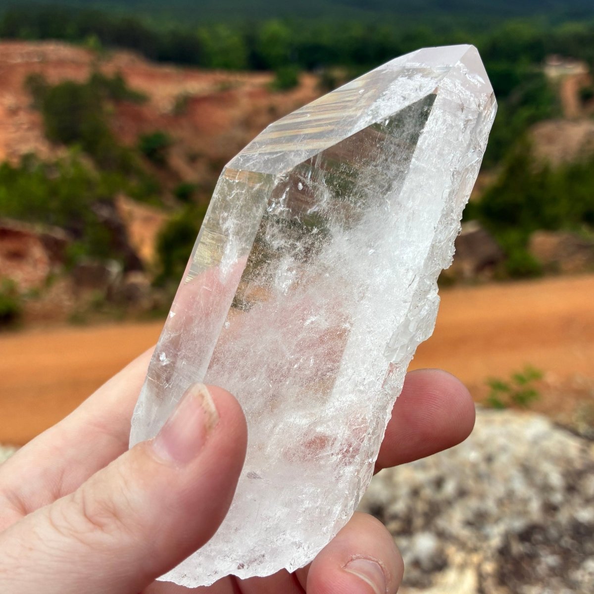 Left side of this Quartz crystal point, outdoors and in front of the Ron Coleman crystal mine.
