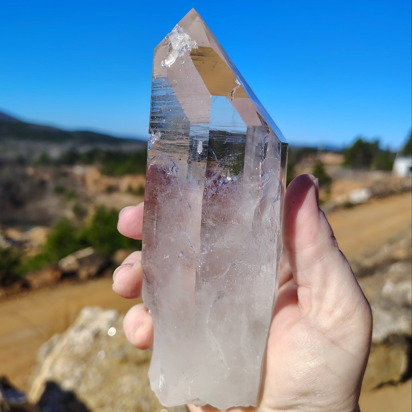 Right side of this pristine clear quartz crystal point in front of the Ron Coleman crystal mine.