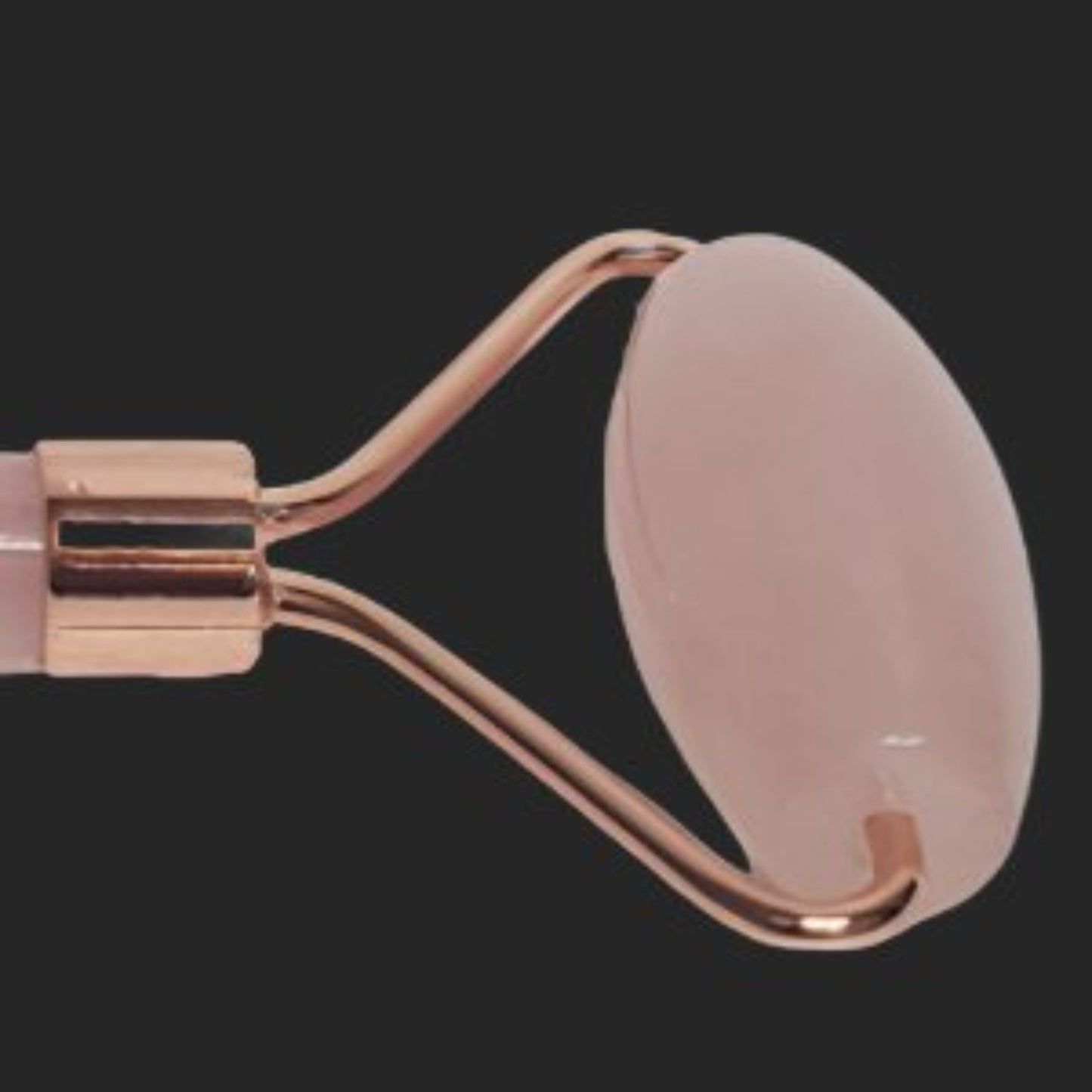 Close Up Of The Rose Quartz Roller on a Face Roller