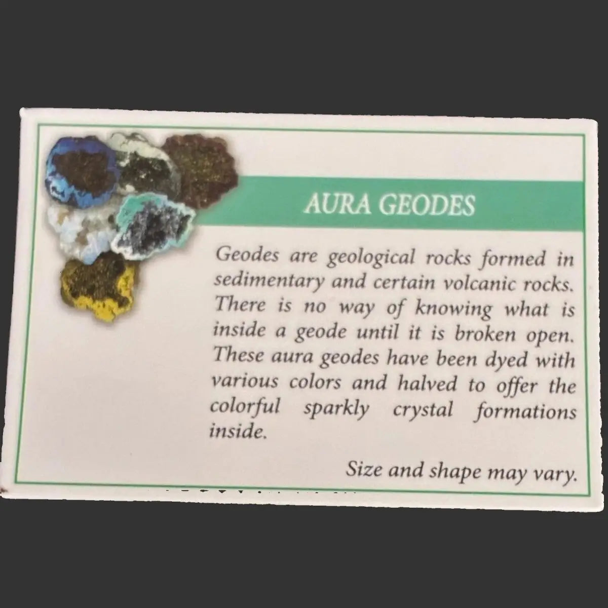 Aura geodes with a descriptive card on a dark background