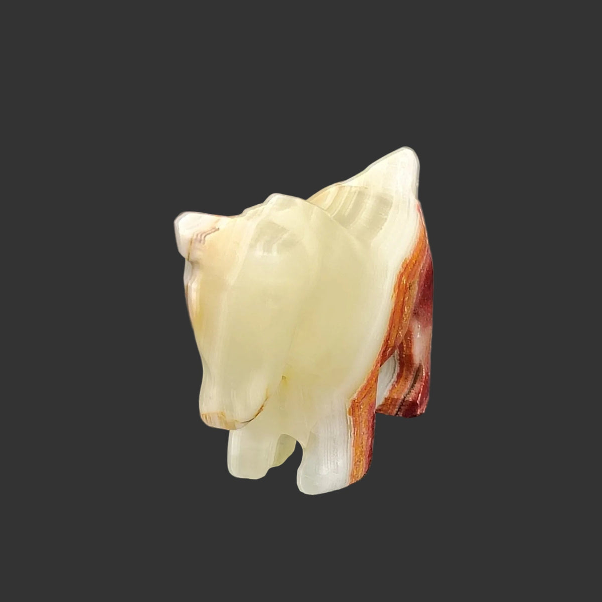 The front side of this polished horse figurine is mostly green in color, with a little cream.