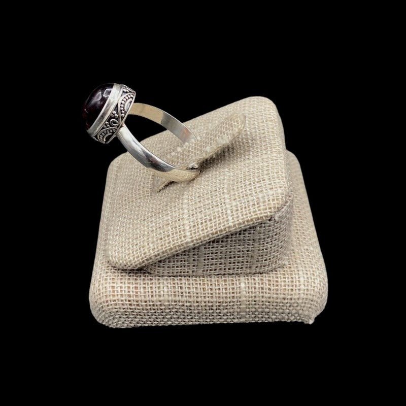 Side View Of Sterling Silver And Tourmaline Gemstone Ring, The Setting The Gemstone Is Placed In Has A Paisley Design