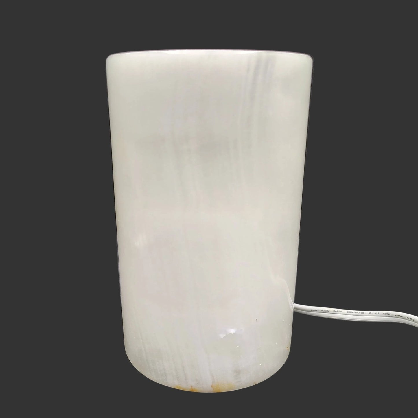 This is what the polished cream-colored cylinder table lamp looks like with the lamp turned off.