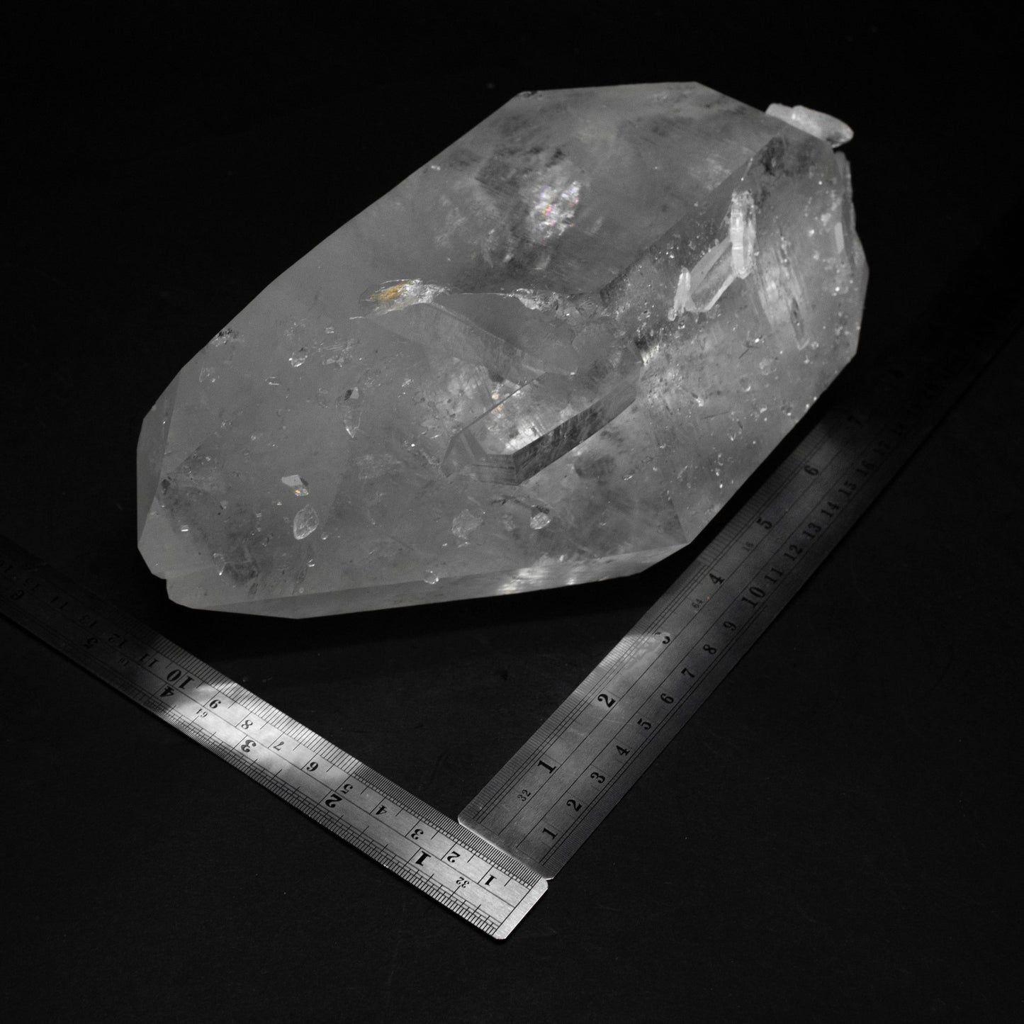 Crystal Point And Two Metal Rulers On A Black Background