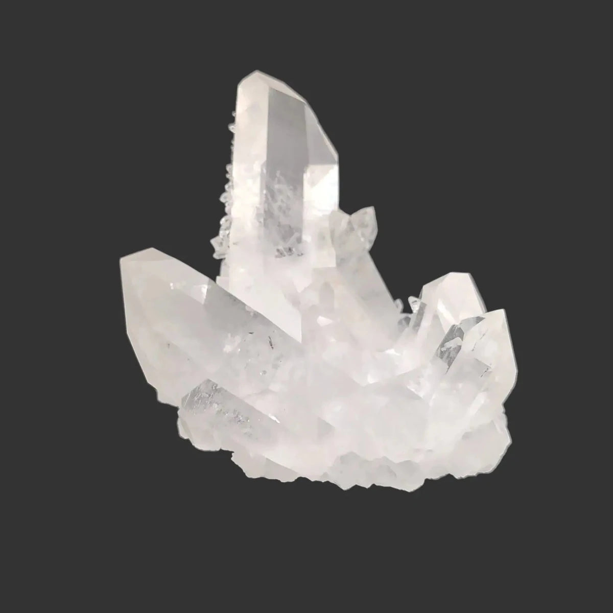 This is the right side of this water clear Quartz crystal cluster, on a black background.
