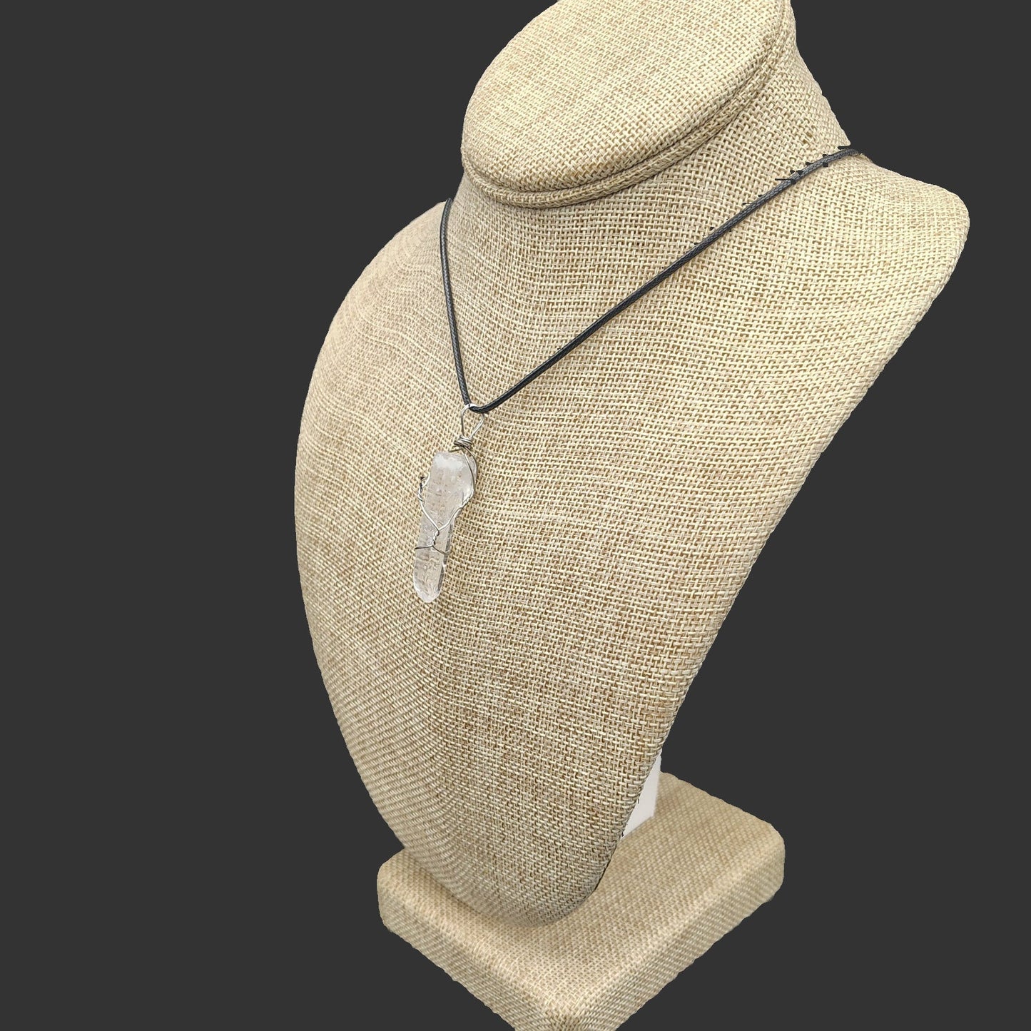 The quartz crystal point lays beautifully, from any angle.