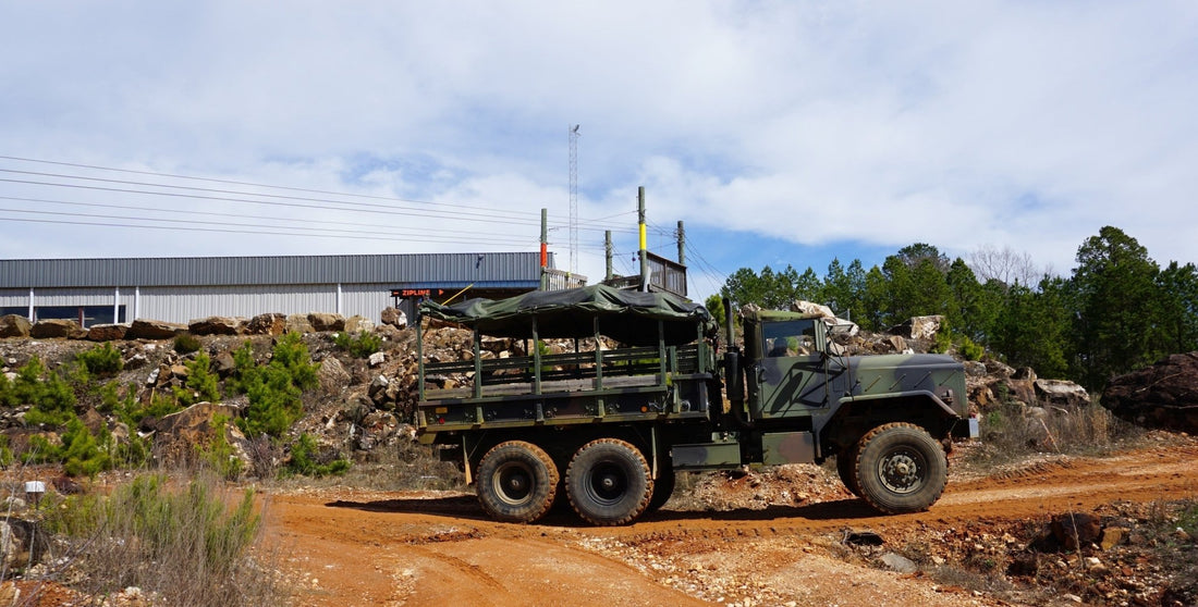 Military vehicle driving through the public digging areaat Ron Coleman Mine