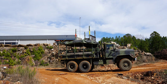 Military vehicle driving through the public digging areaat Ron Coleman Mine