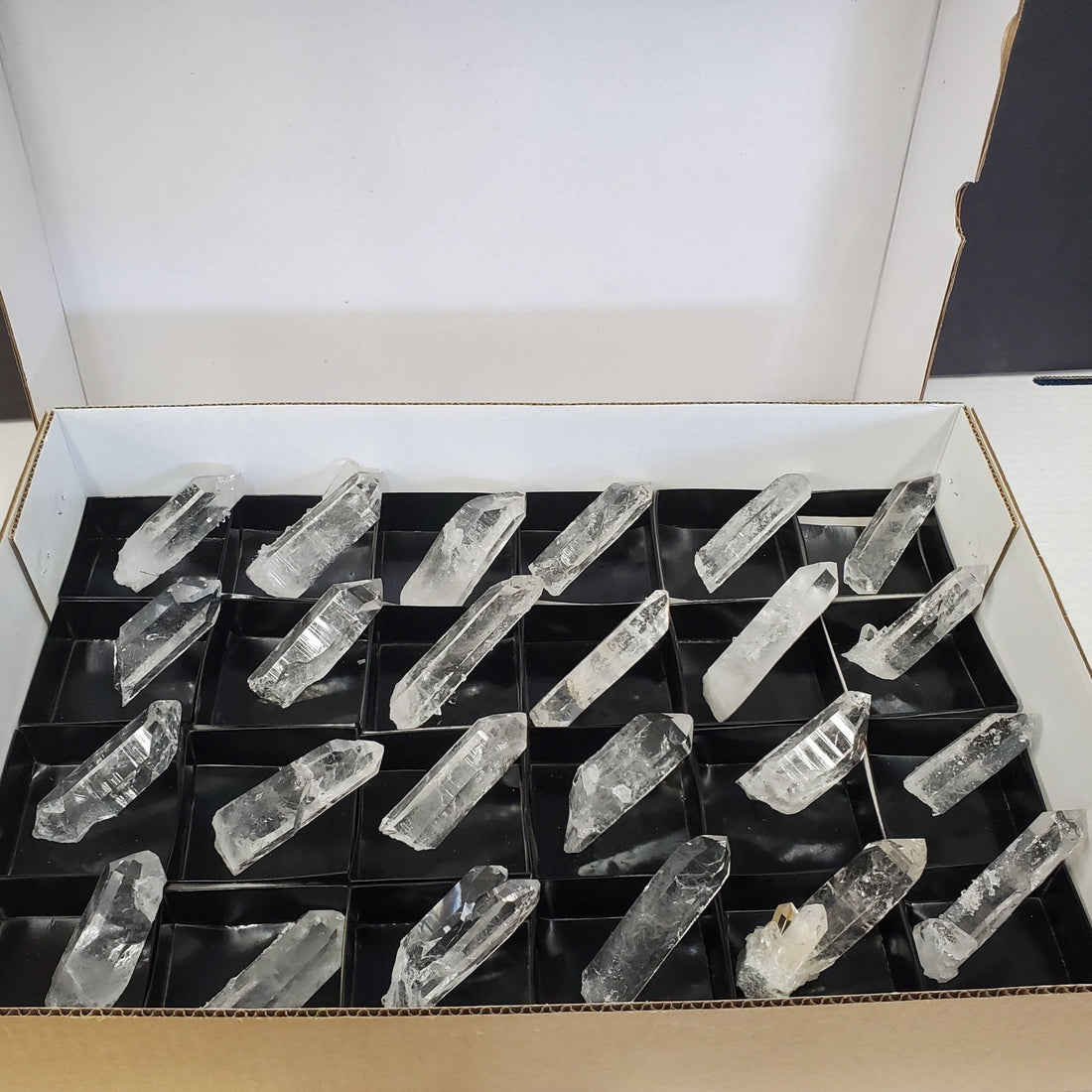 box of crystal points black background
