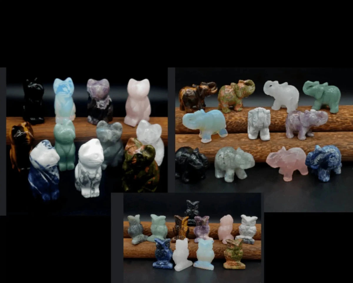 Multiple carved stone animal figurines on a black background