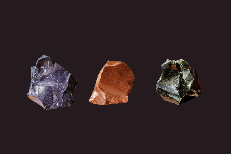 Green Goldstone, Red Goldstone and Blue Goldstone on a black background