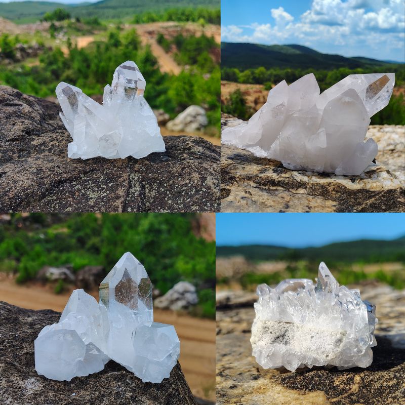 4 raw crystal clusters sitting on a boulder in natural setting