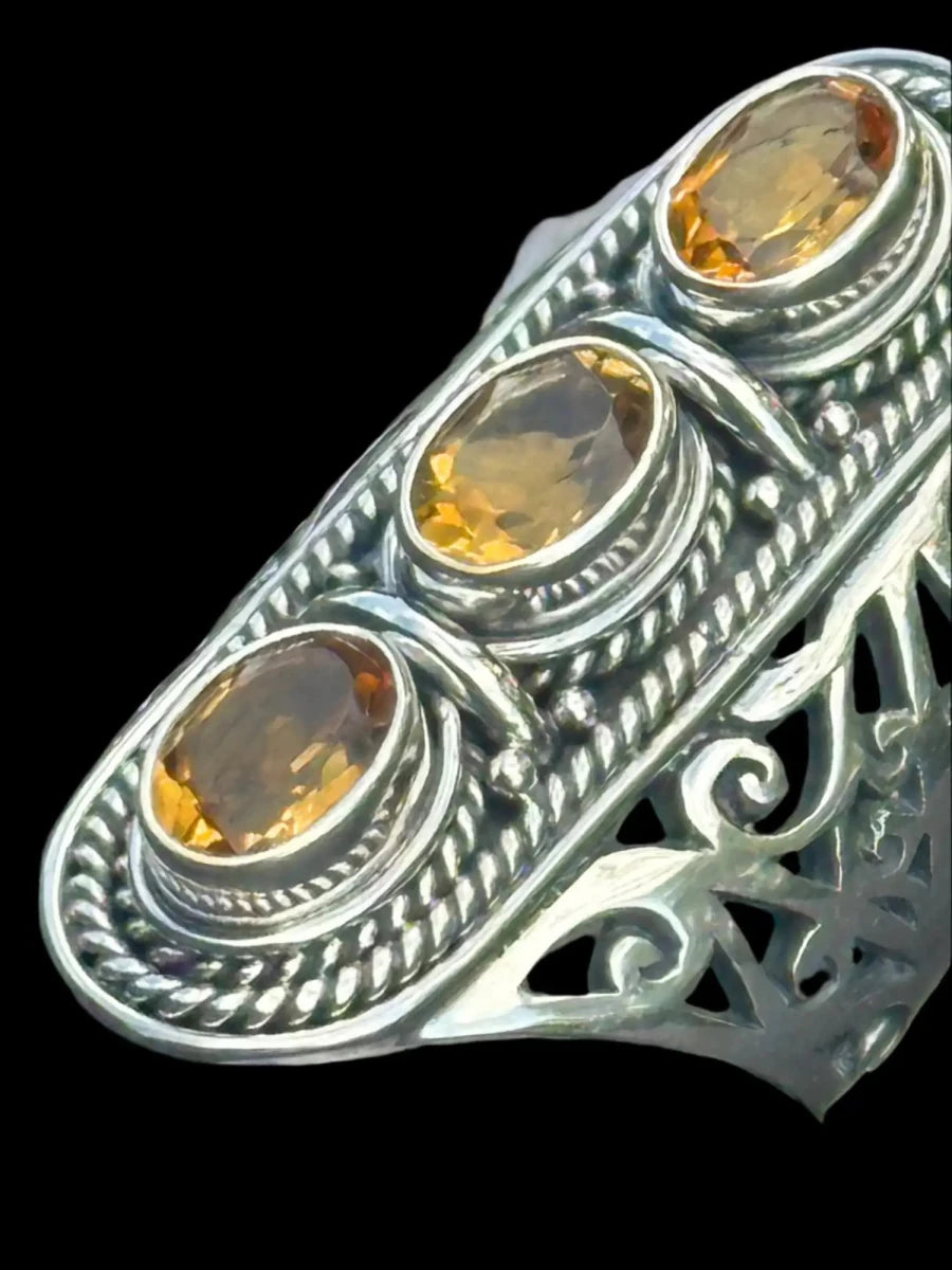 Close Up View Of 3 stone Citrine Ring With Rope Design Bezels And Top Open Design Sides