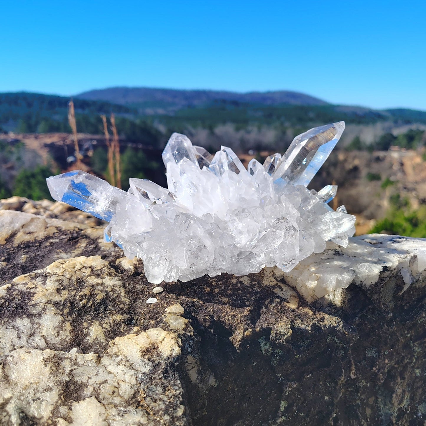 Front view of Quartz crystal cluster in front of the Ron Coleman crystal mine.
