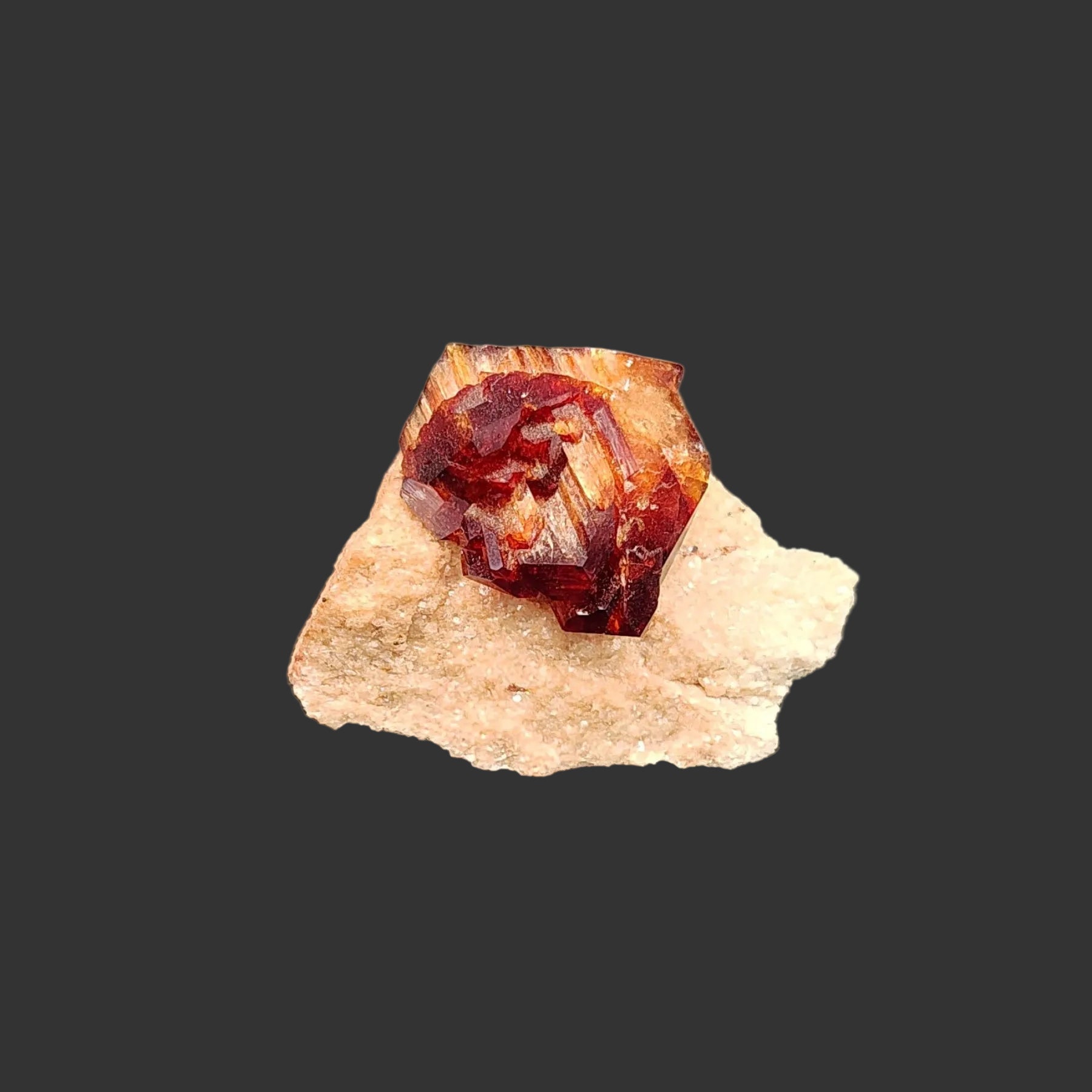 This is the front view of this Arcanite mineral specimen. The crystal formation is a reddish brown and the base is tan in color.