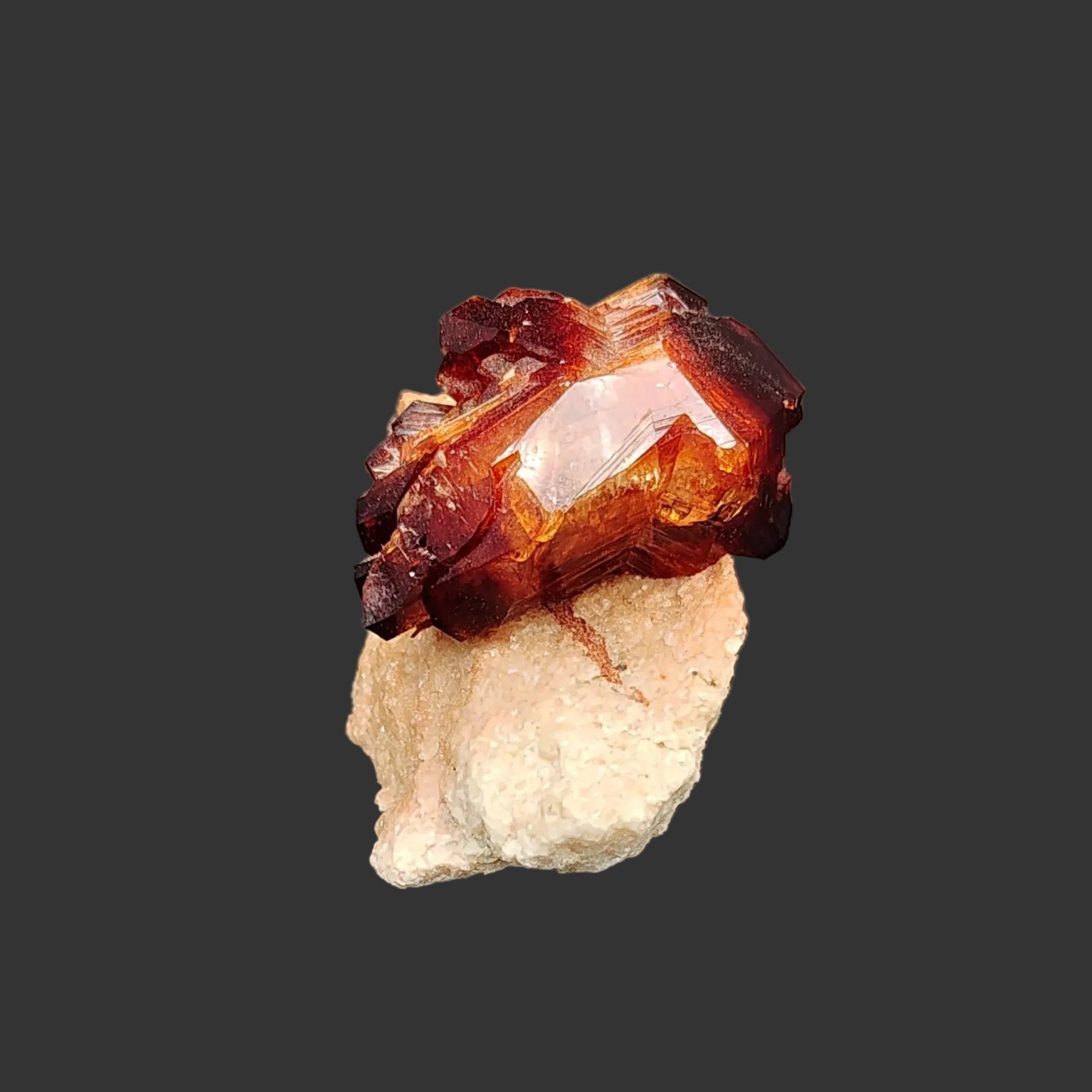 From the side view, you can see a little bit of both the brown Arcanite crystal and the tan base.