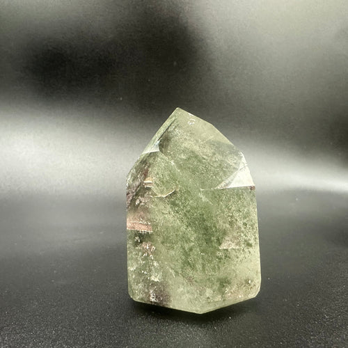 Green Chlorite Within A Cut And Polished Brazilian Crystal Point