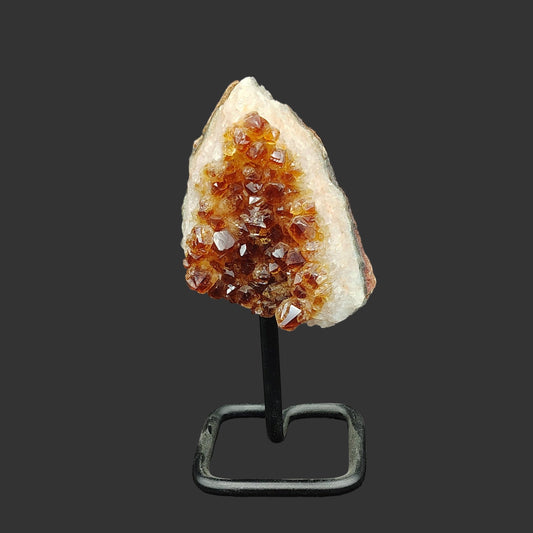 This is the front side of this citrine cluster on a metal stand