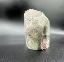 Load image into Gallery viewer, Side View Of Chlorite Quartz Point Showing The Green Chlorite Growths Within The Miner

