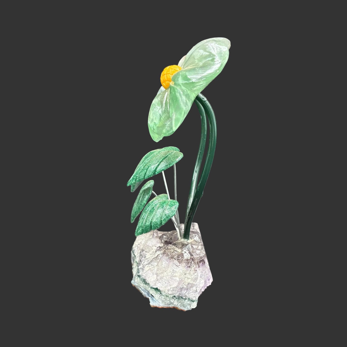 Side view of this green fluorite double daisy on a amethyst base.