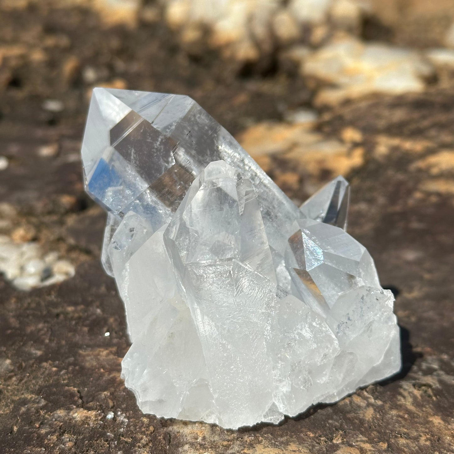 Cluster of Crystals With A Thick Point The Blue Reflection Is From A Penetrator Growth Inside 