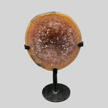 Load image into Gallery viewer, Front View Of Agate Half Geode On Black Metal Stand, Polished Brown Edges With Brown Crystals In The Center
