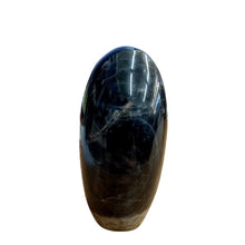 Load image into Gallery viewer, Side View Of Black Moonstone Cut Base, Polished Oval Shaped Shimmery Taupe And Black In Color
