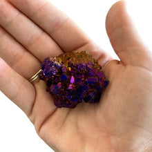 Load image into Gallery viewer, Purple Aura Quartz Geode Mineral Specimen, Face Is Covered In Crystals That Are Puprle Gold And Blue In Natural Light.
